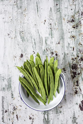 Fresh green beans on a white background