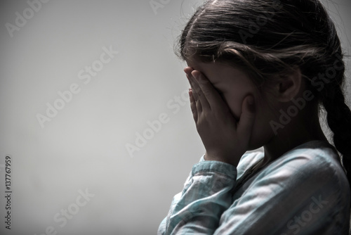 Little girl hiding her face © Viacheslav Yakobchuk