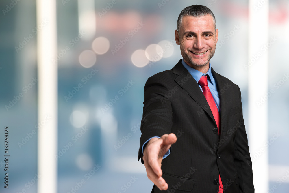 Businessman giving an handshake Businessman giving an handshake