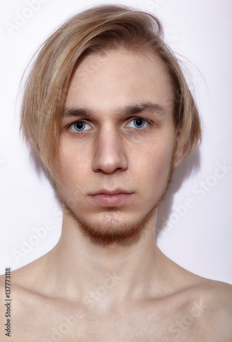 Young blonde man posing