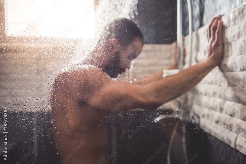 Afro American man taking shower