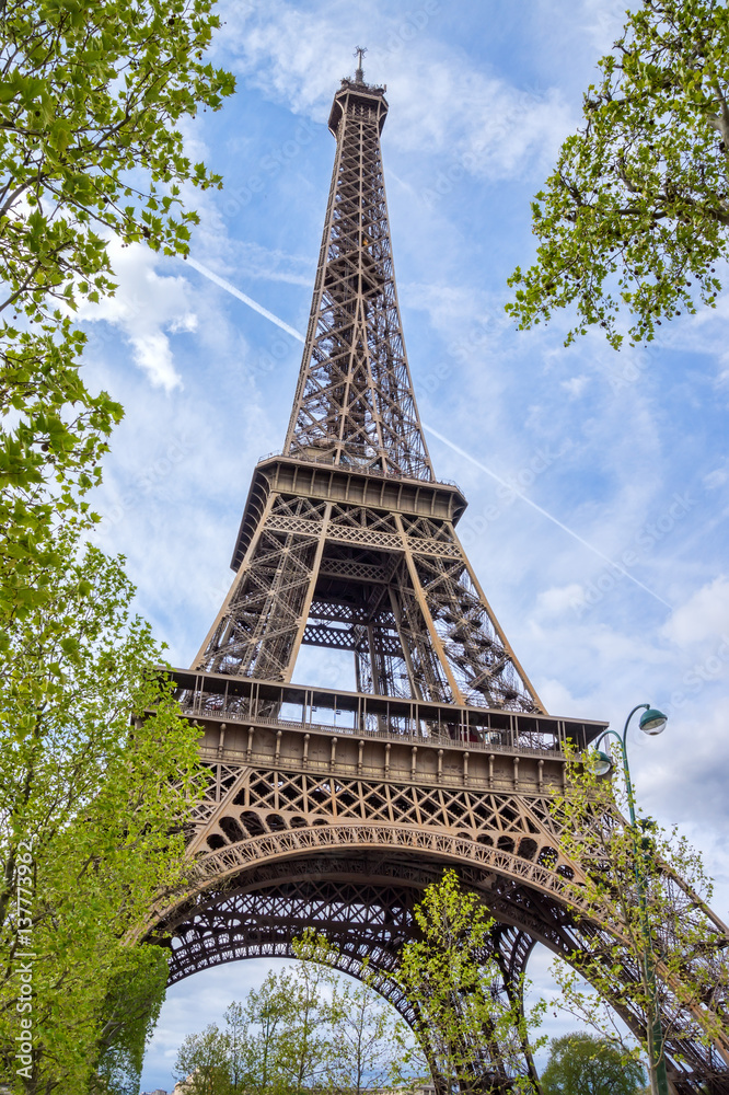Eiffel tower with blue sky in the background.