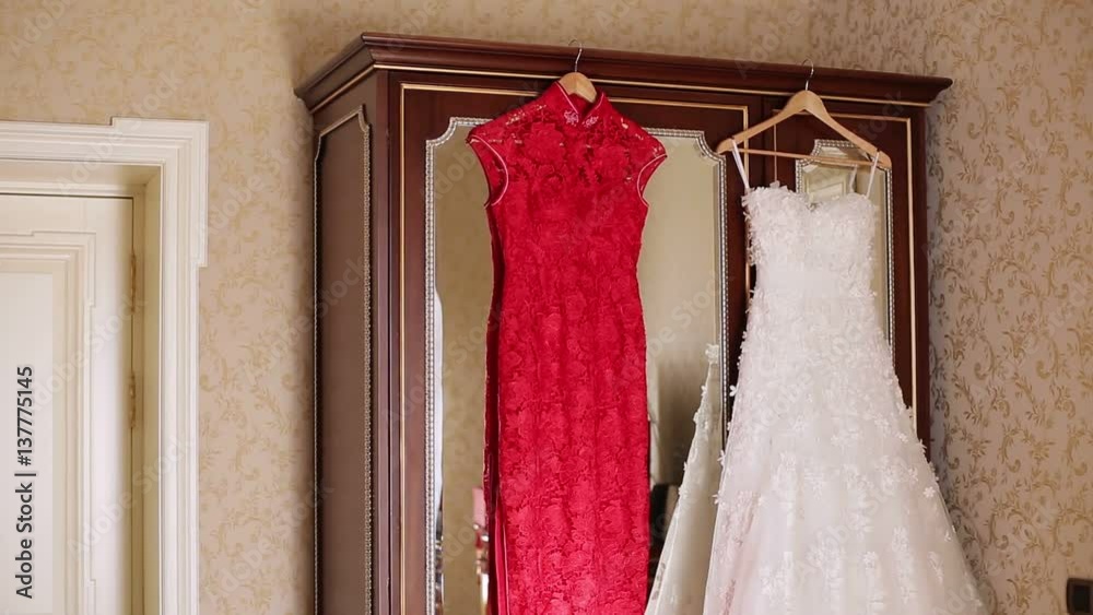 Red and white wedding dresses in room Red and white wedding dresses in room