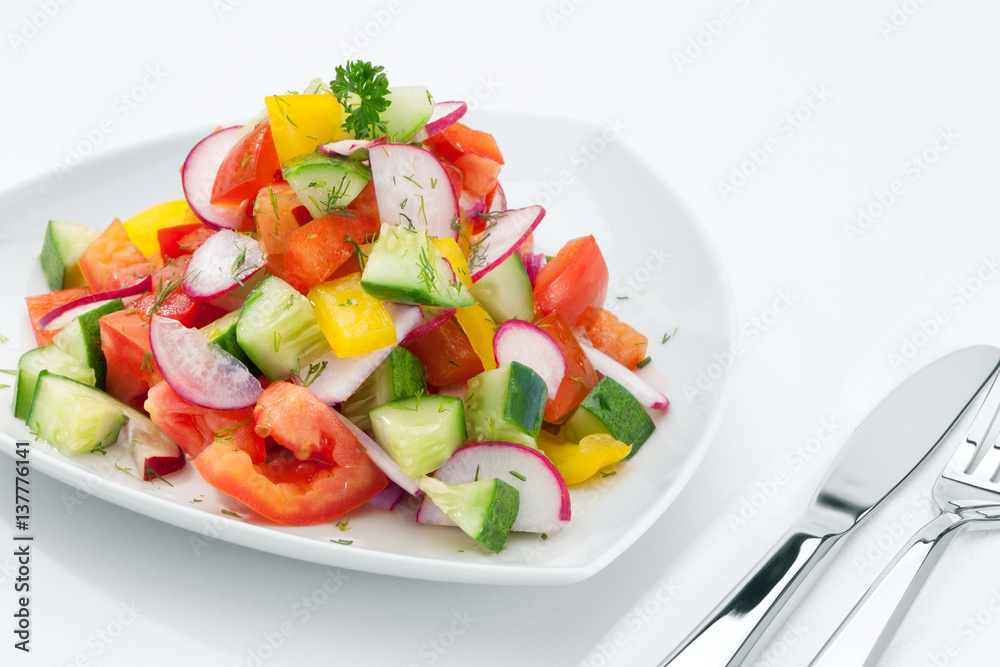 close up view of fresh vegetable salad on white background close up view of fresh vegetable salad on white background