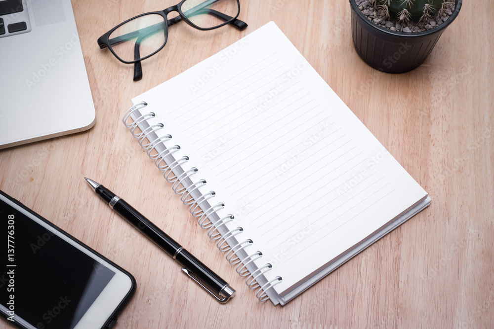 blank notebook with pen on wooden table, business concept. blank notebook with pen on wooden table, business concept.