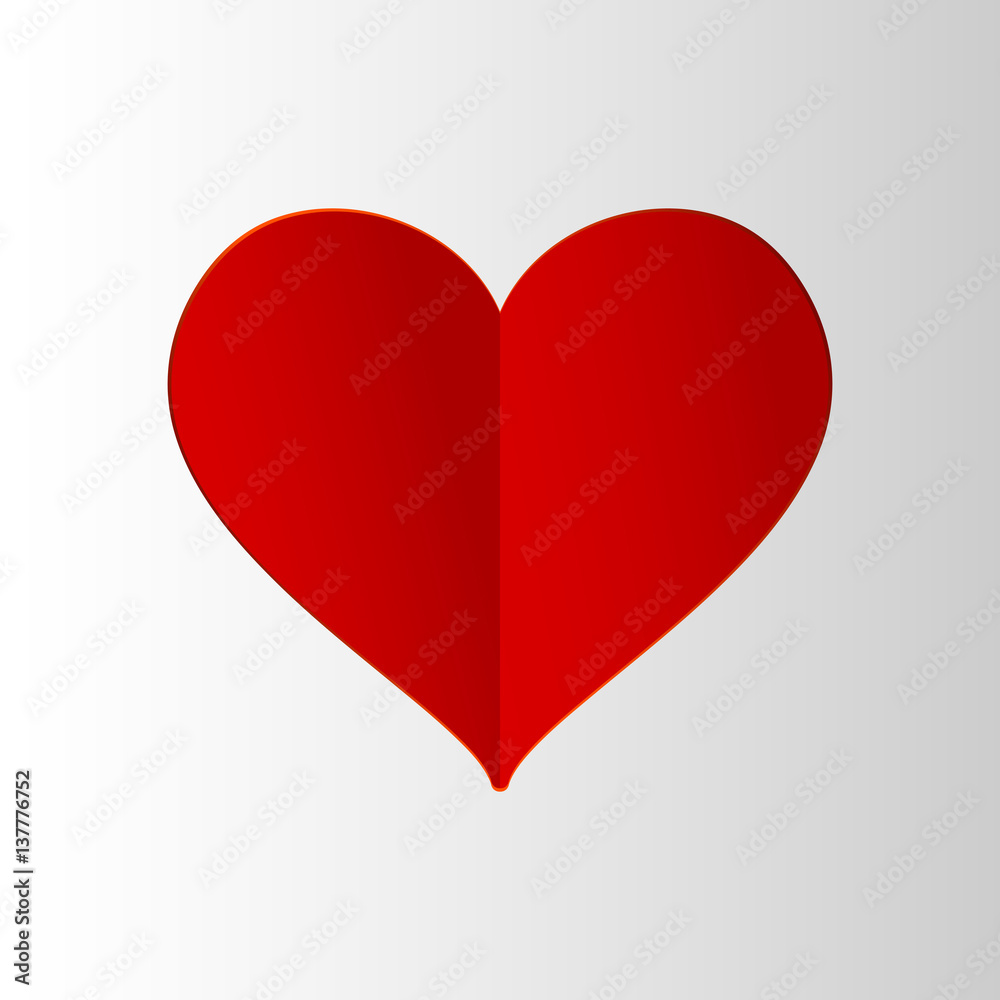 Red paper heart on gray background