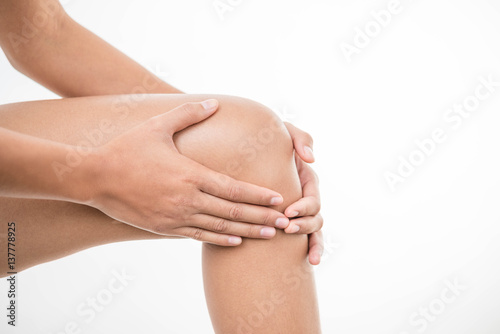 Tendon knee joint problems closeup cropped image woman leg isolated on  white background. Joint trauma concept