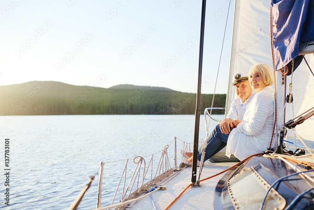 Relaxed senior couple enjoying morning on yacht