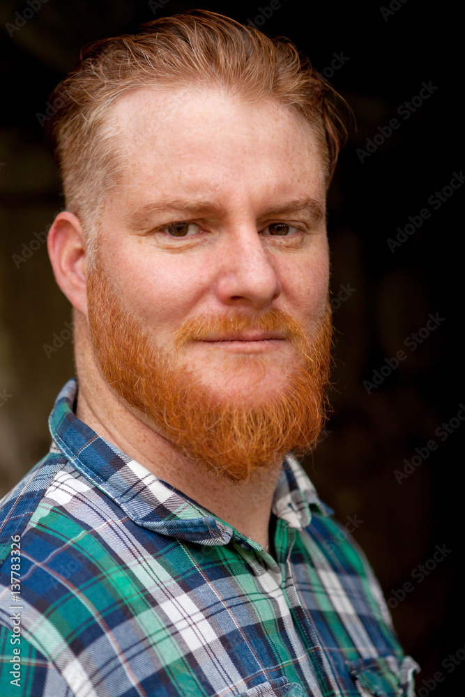 Fototapeta premium Portrait of red haired man with long beard
