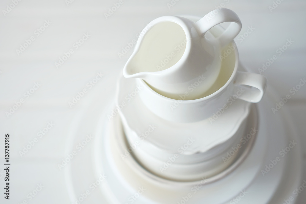 Minimalist picture of white porcelain kitchenware piled up Minimalist picture of white porcelain kitchenware piled up