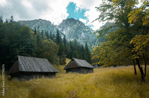 Old traditional wooden cabin in Poland and the Giewont peak © Graduated Grey