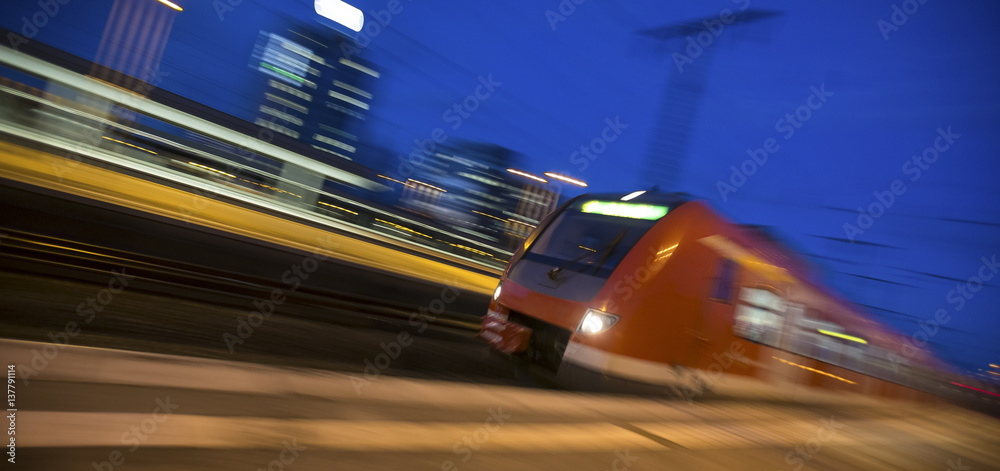 speeding passenger train in the evening
