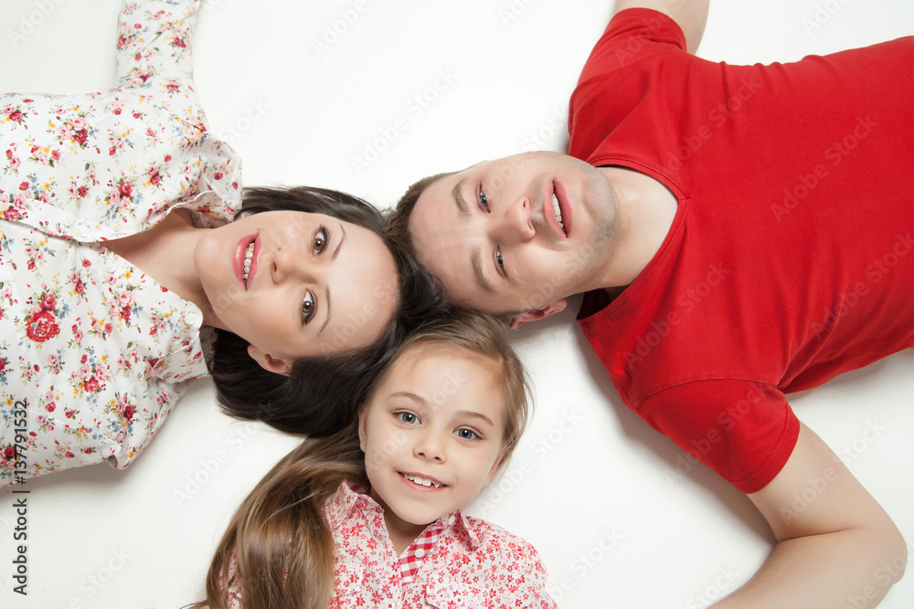 High angle portrait of happy family lying 