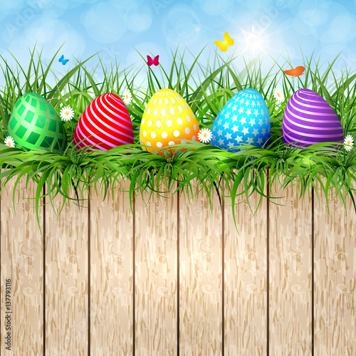 Golden Easter eggs on a wooden background