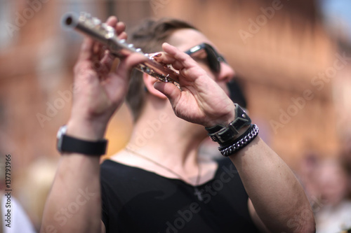 Musician plays the flute at a rock concert