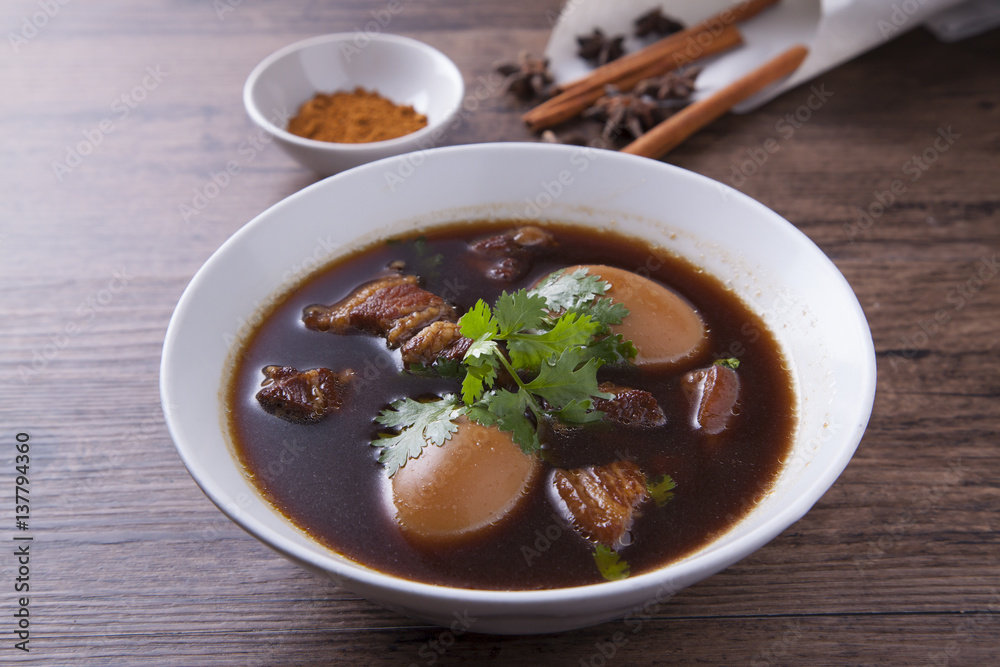 Stewed eggs with pork in the white bowl Stewed eggs with pork in the white bowl