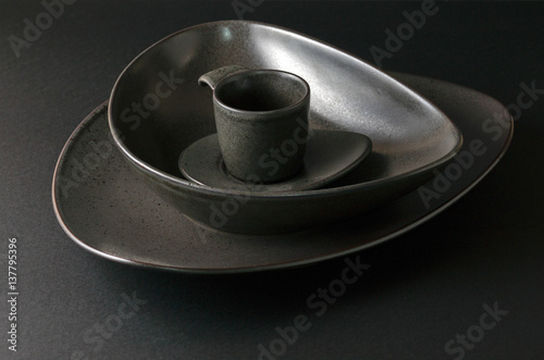 Fototapeta Naklejka Na Ścianę i Meble -  black empty plates with coffee cup, plate setting. Black and white picture