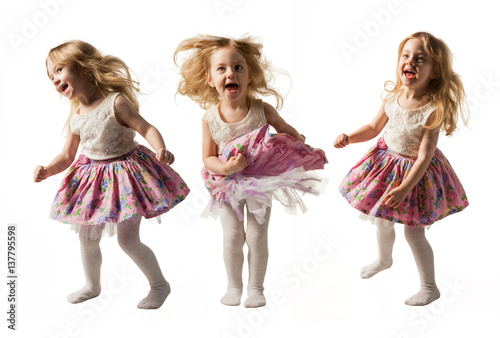 Cute little girl jumping with joy isolated on white background