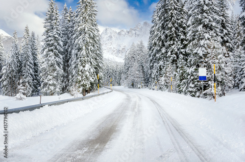 Deserted Road Through a Winter Mountain Landscape.Treacherous Driving Conditions.