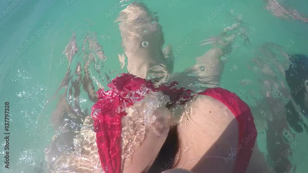 Woman in Red Bikini Swimming With Gopro Stock Video | Adobe Stock