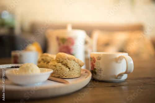 Close up Scones with butter and tea on the table