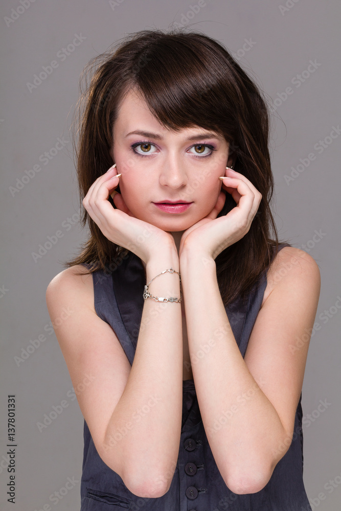 Closeup portrait of dreamy woman isolated on gray Closeup portrait of dreamy woman isolated on gray