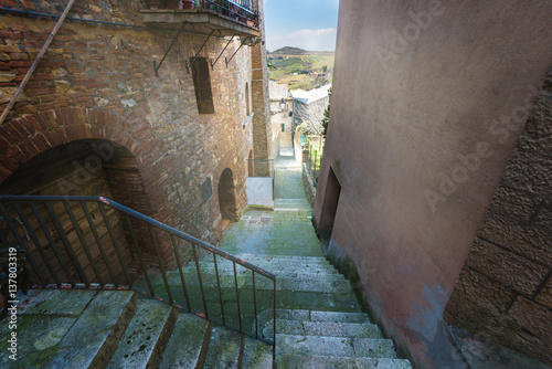 Hidden alley somewhere in the Tuscan town of San Casciano dei Bagni. photo