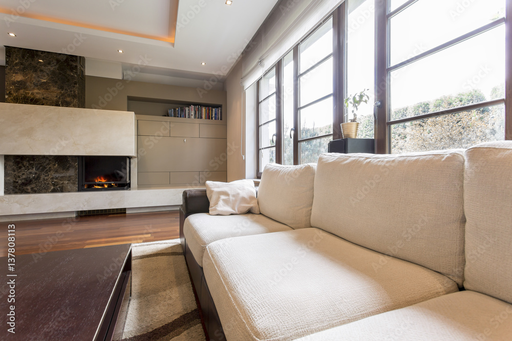 Fototapeta premium Beige sofa in sitting room
