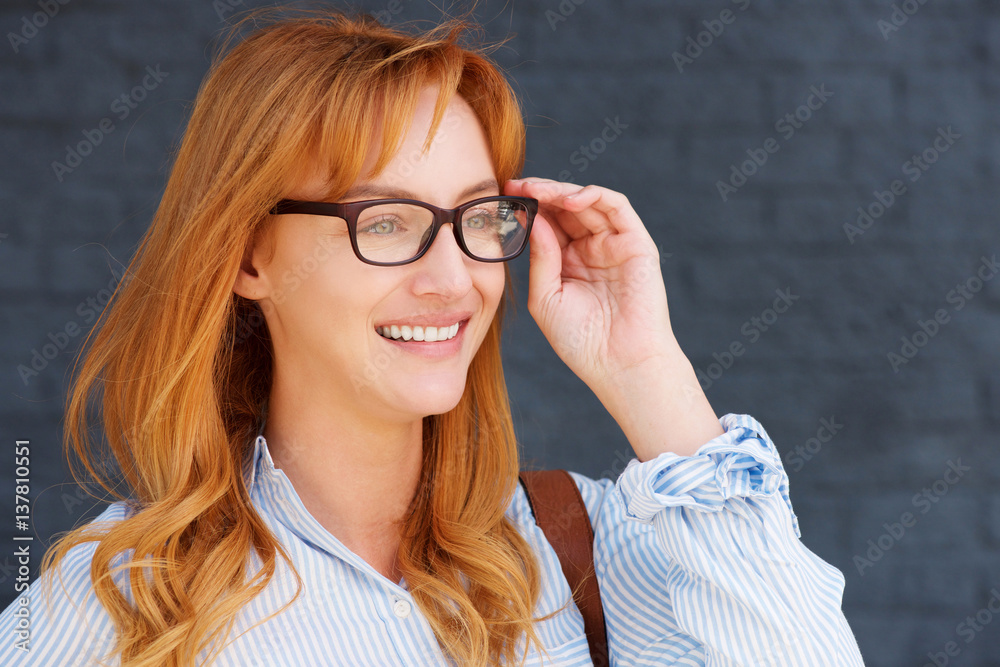 happy business casual woman with hand to glasses happy business casual woman with hand to glasses
