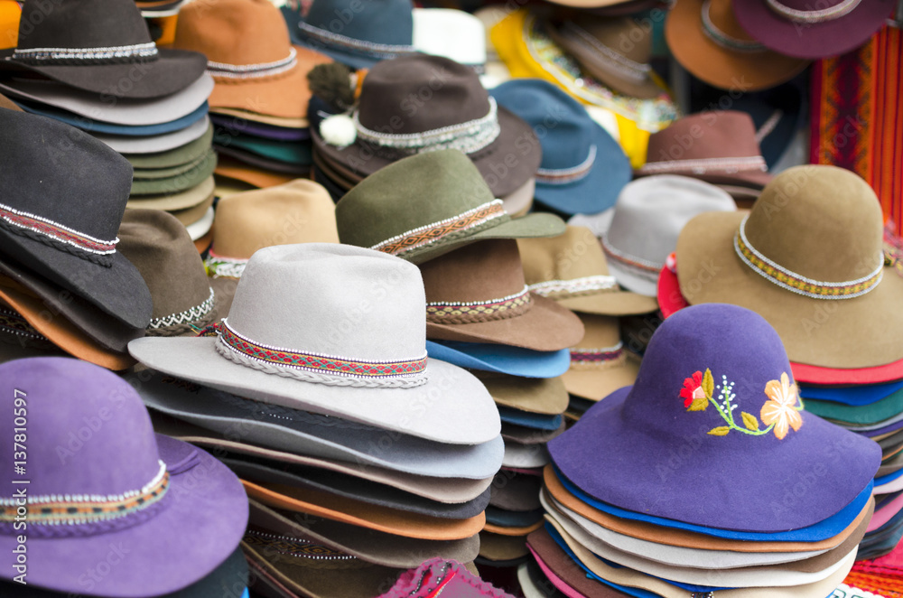 Numerous hats at the market