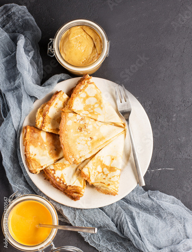 Pancakes with pumpkin cream and homemade peanut butter, vertical, soft focus
