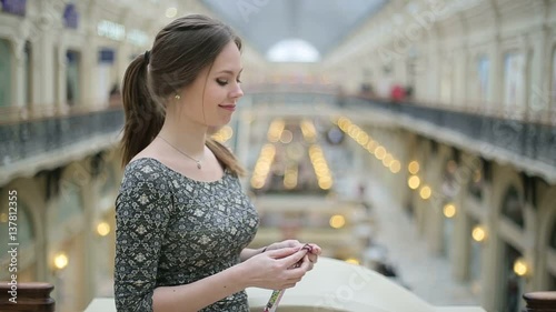 Young woman eating chocolate bar