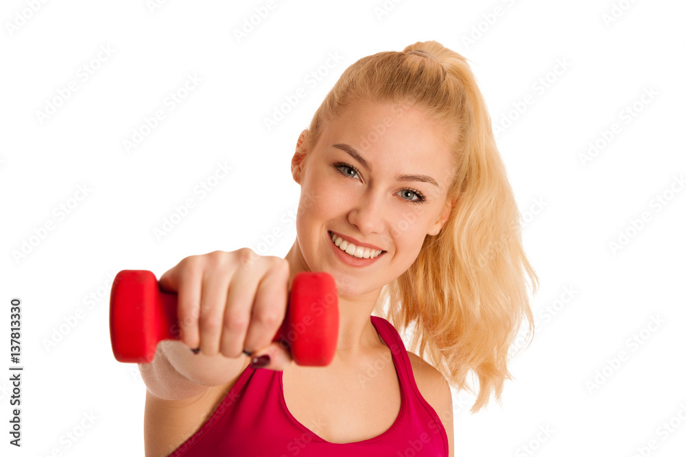 Cute young blond woman working out in fitness gym isolated over white background Cute young blond woman working out in fitness gym isolated over white background