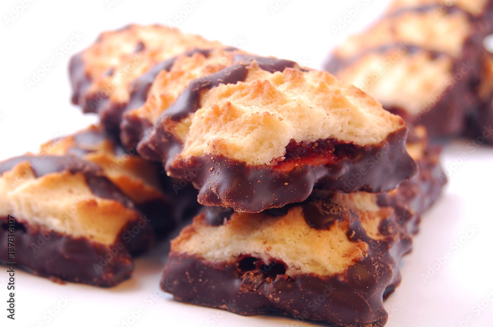 Pile of shortbread cookies with jam and chocolate icing