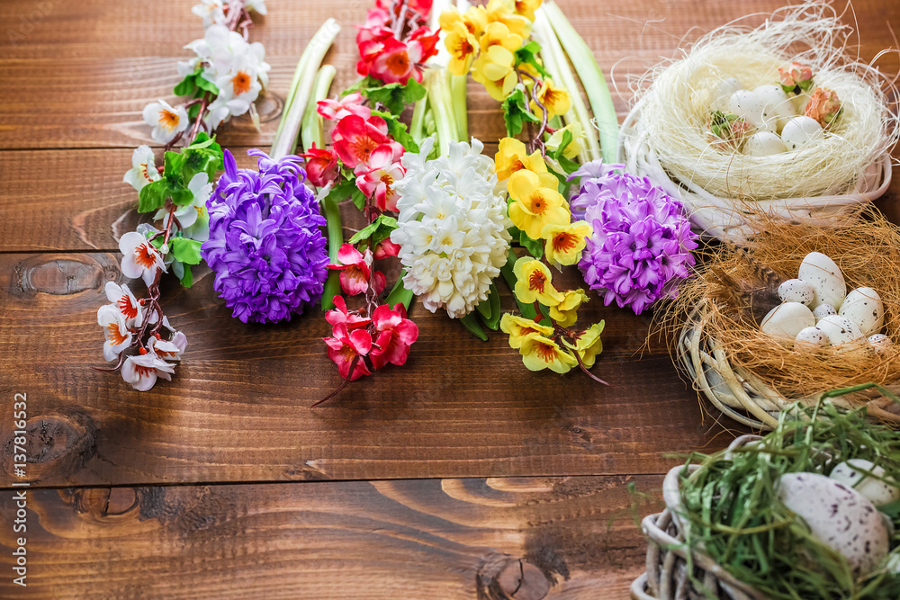 Beautiful Easter eggs with flowers hyacinths on the wooden background Beautiful Easter eggs with flowers hyacinths on the wooden background