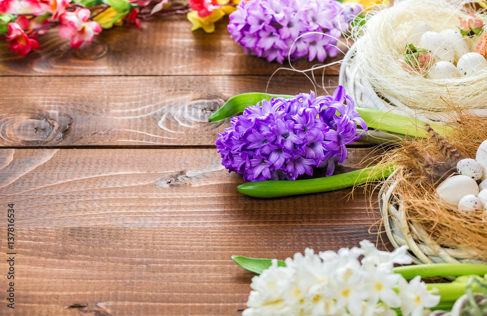Beautiful Easter eggs with flowers hyacinths on the wooden background Beautiful Easter eggs with flowers hyacinths on the wooden background