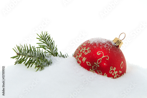 Christmas decoration, red Christmas tree ball in the snow photo