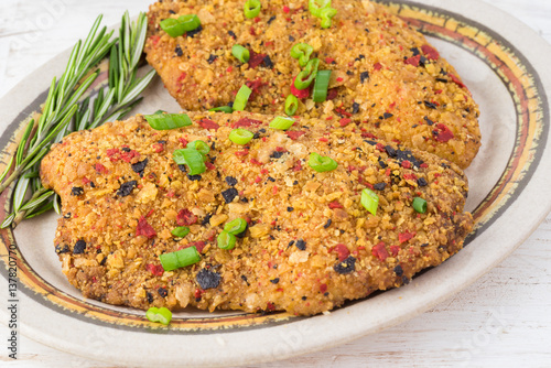Baked fillets of tilapia coated with tortilla, chipotle and lime crust.