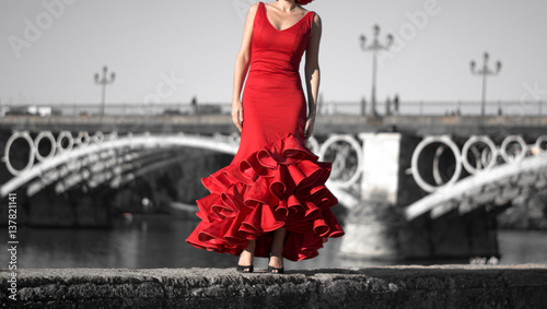 A beautiful Spanish woman with a passion red dress