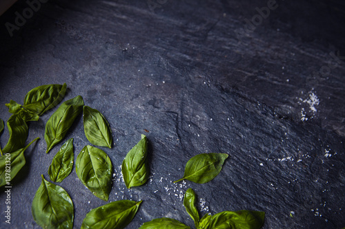basil leaves on food background