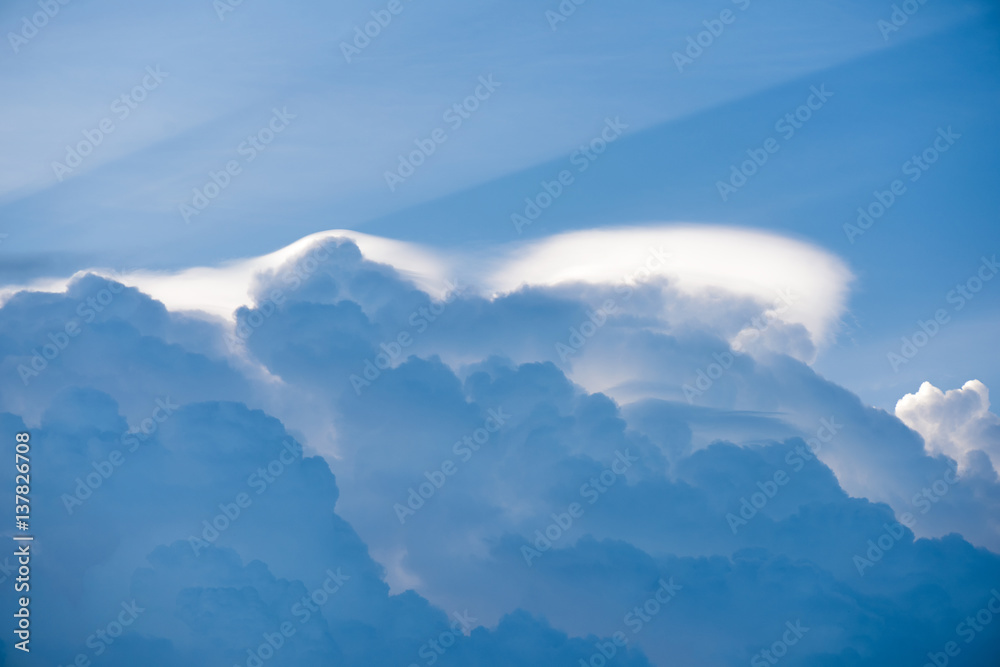 Closeup white cloud and sunbeam with blue sky for nature background