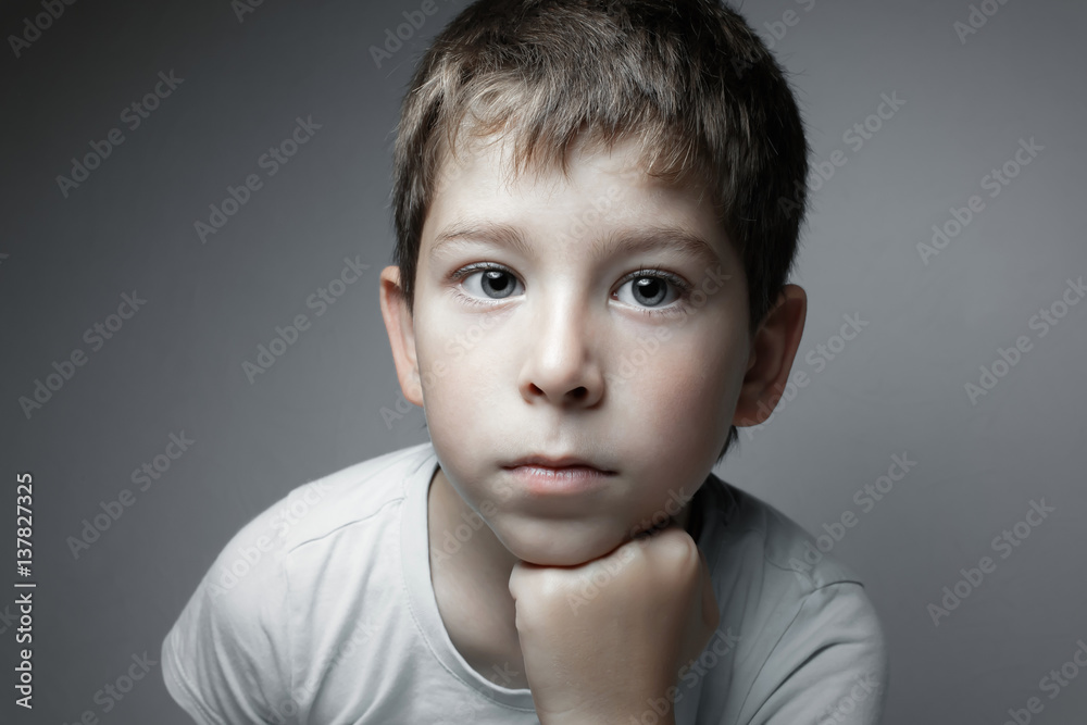 Portrait of a handsome boy looking in cam Portrait of a handsome boy looking in cam