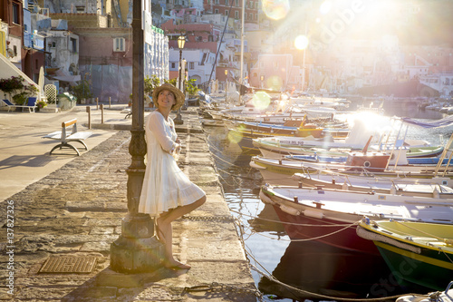 Italian summer fashion - happy girl in a white lacy dress