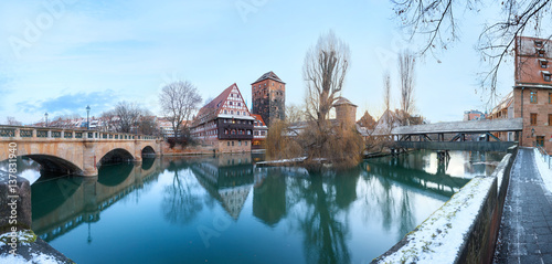 Winter panorama of Henker haus and Henkersteg bridge over Pegnitz river in Nuremberg, Bavaria, Germany © lena_serditova