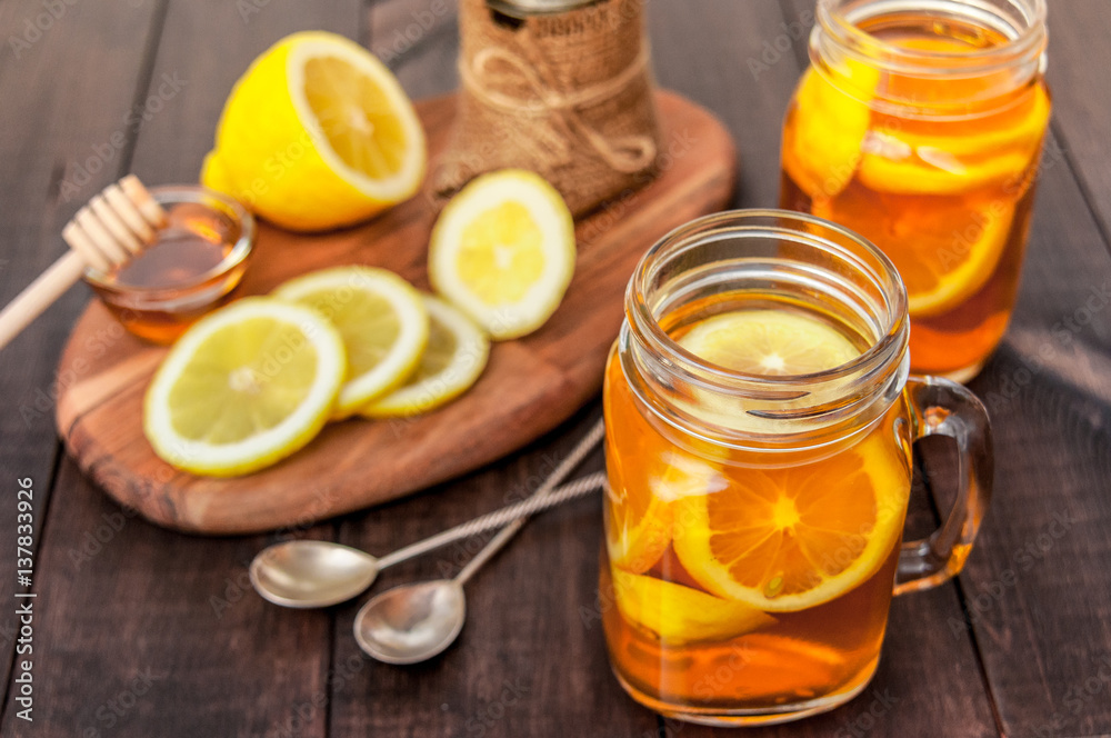 Hot tea with lemon and natural honey, good treat to have vitamins and strong immunity. Hot tea with lemon and natural honey, good treat to have vitamins and strong immunity.