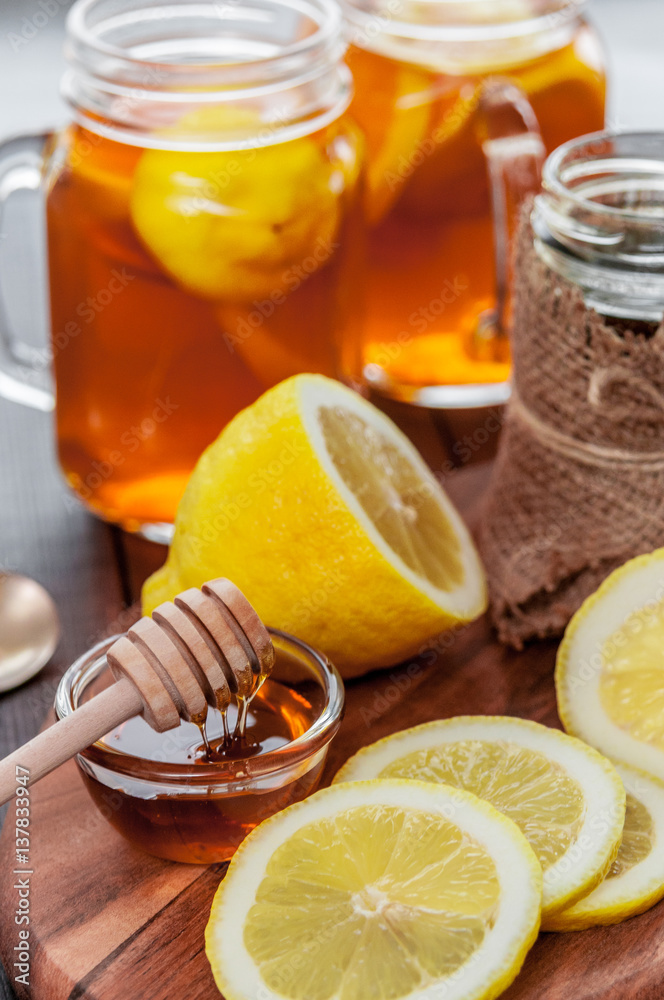 Hot tea with lemon and natural honey, good treat to have vitamins and strong immunity. Hot tea with lemon and natural honey, good treat to have vitamins and strong immunity.