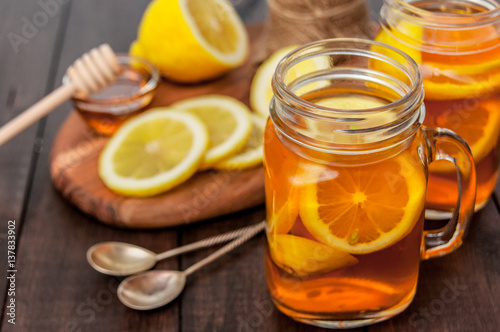 Hot tea with lemon and natural honey, good treat to have vitamins and strong immunity.