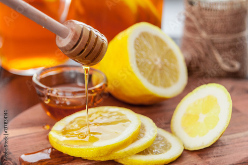 Hot tea with lemon and natural honey, good treat to have vitamins and strong immunity.