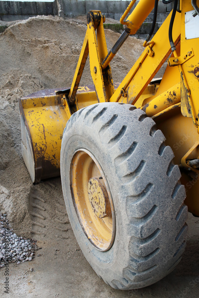 yellow excavator in the sand yellow excavator in the sand