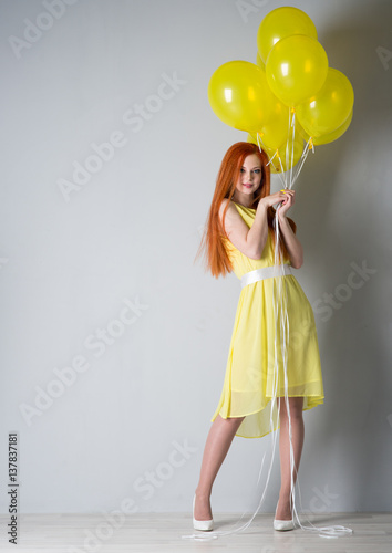 Young woman with balloons